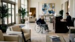 Guest in wheelchair in luxury hotel lobby