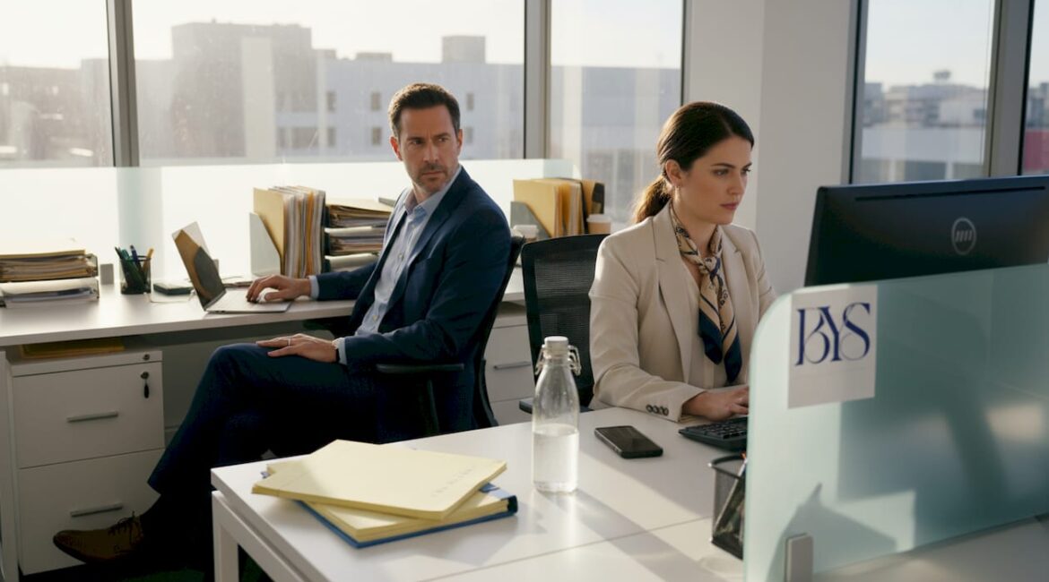 Attorneys working tensely in Mid-Wilshire office